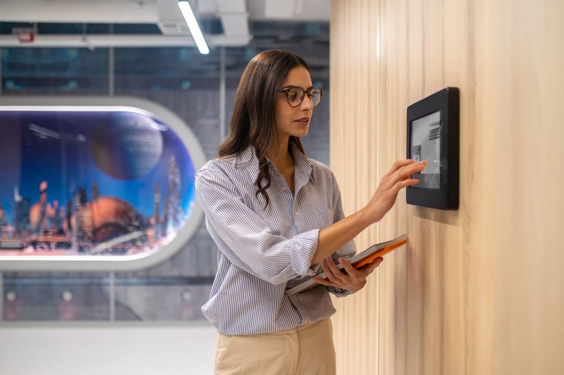 Employee entering a code on a wall-mounted access control panel at a Princeton, NJ office building