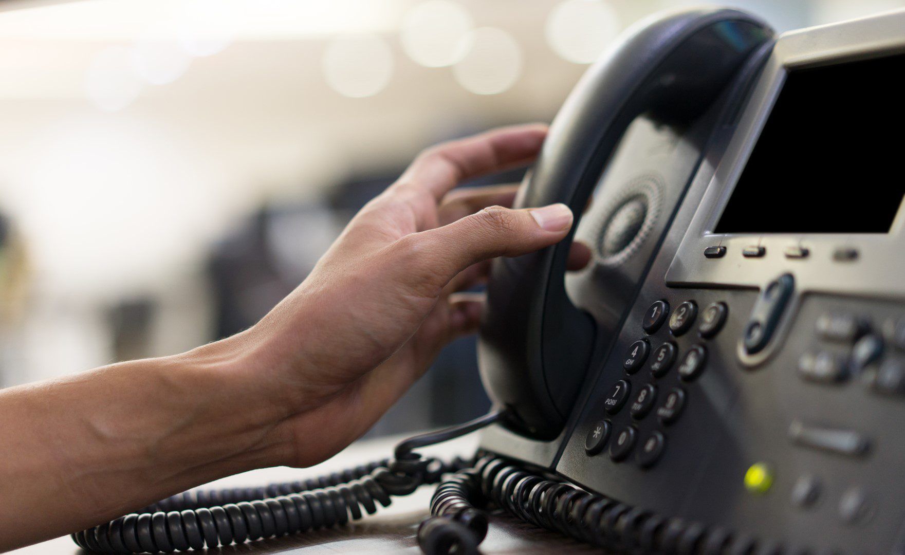 Hybrid VoIP business phone system on a desk