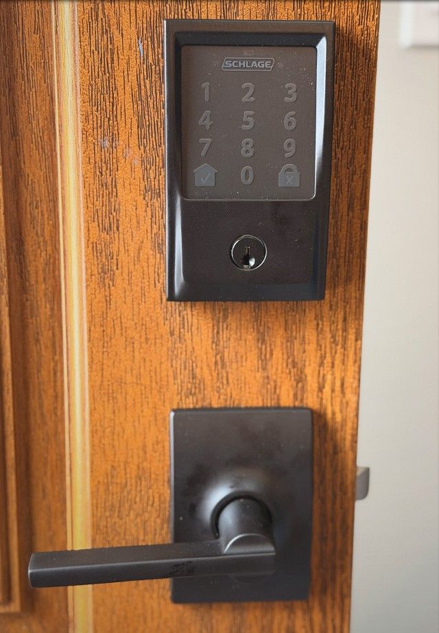 Schlage touchscreen smart deadbolt and lever on a new home's front door